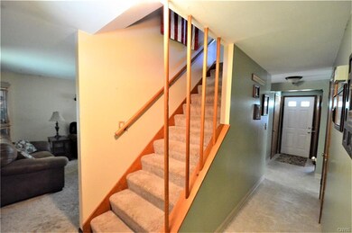 The front foyer welcomes you in to the 4 bedroom h