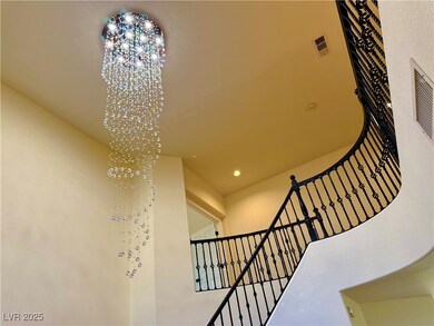 Stairs featuring a chandelier and recessed lightin