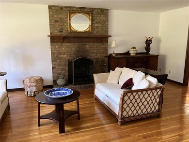 Floor to ceiling brick fireplace with brick hearth