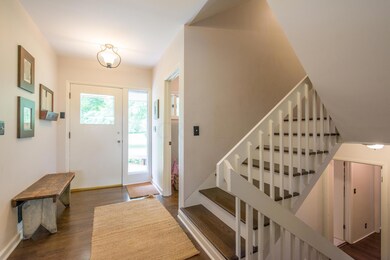 Foyer with gleaming hardwood floors