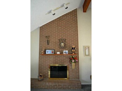 Living Room. floor to vaulted ceiling brick firepl