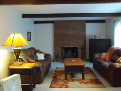 Living Room. 14X13 LIVINGROM WITH A BRICK LOG BURN