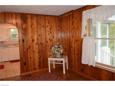Wood paneled Dining Room with wood flooring