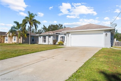 Ranch-style home with central AC unit, a front yar