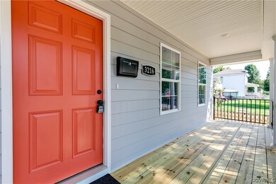 View of exterior entry featuring covered porch
