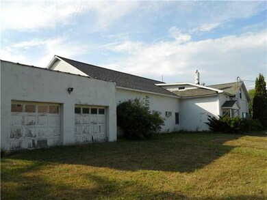 View. East side of building. Note side entrance wi