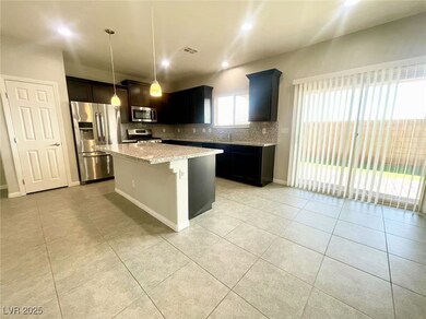 Kitchen featuring light tile patterned floors, a c