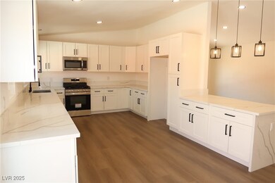 Kitchen with appliances with stainless steel finis