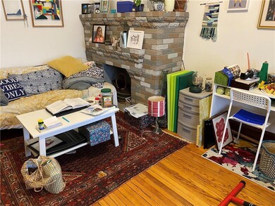 unit 1 living room with brick fireplace