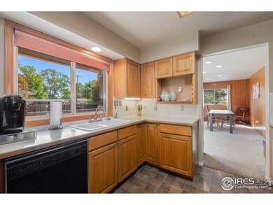 Large window above the sink overlooking patio and backyard