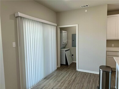 Unfurnished dining area featuring visible vents, s