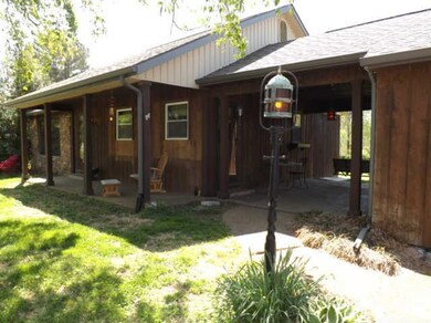 Handsome, old style lanterns welcome you down the aggregate sidewalk to the covered front porch or breezeway.