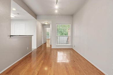 Empty room with light hardwood / wood-style floori