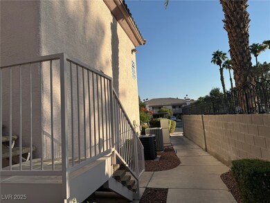View of side of property with stucco siding, fence