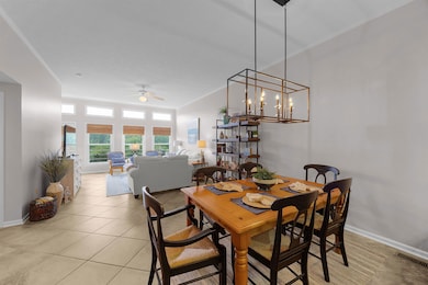 Dining room featuring a ceiling fan, ornamental mo