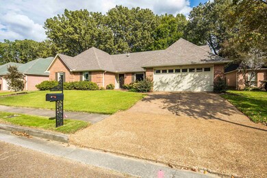 Single story home featuring a garage and a front l