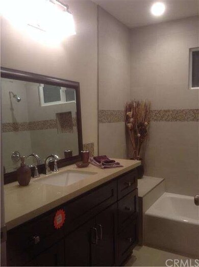 Bath with decorator tile, Kohler tub and toilet an