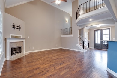 Unfurnished living room featuring ornamental moldi