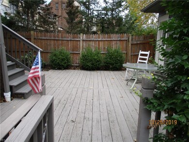 A deck between the rear of the home and the garage offers privacy and summer enjoyment.
