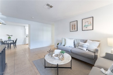 Living area featuring a textured ceiling, visible