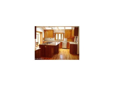 Gorgeous Cherry Kitchen with Granite Tops and Hard