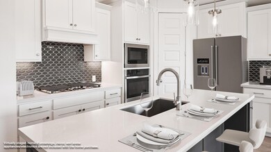 Kitchen with appliances with stainless steel fini