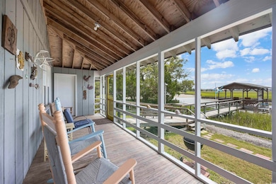 Sunroom with vaulted ceiling with beams