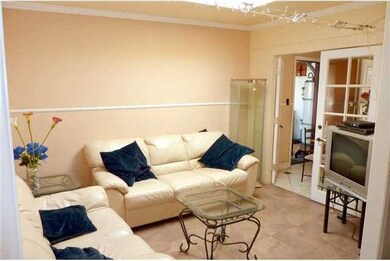 French doors lead into kitchen... nice neutral cer