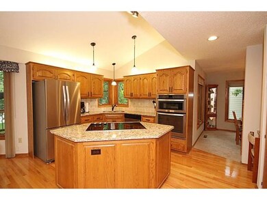 The kitchen has been updated with granite, natural
