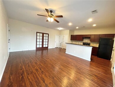 Kitchen with visible vents, decorative backsplash,