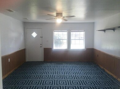 Living Room...Carpet Is Removable To Vinyl Underne