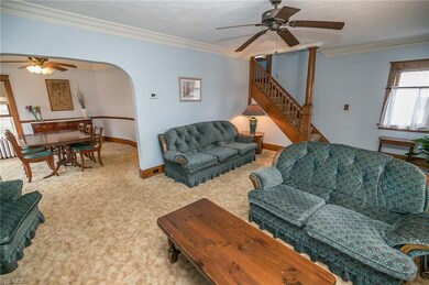 Rounded archways and deep crown molding add to the charm.