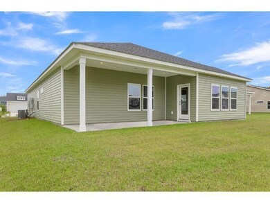 Back of house with central AC, a yard, and a patio