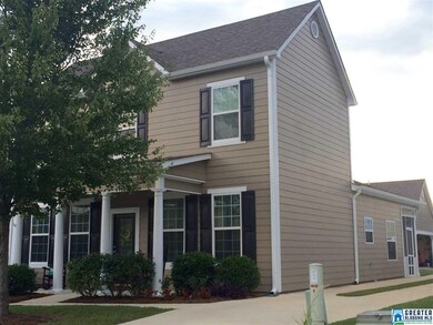 Side view of home and detached garage in the back.