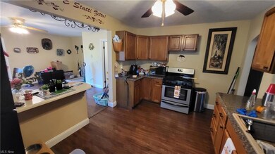Kitchen featuring dark countertops, stainless stee