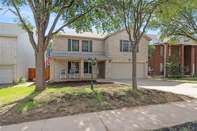 Traditional-style home featuring covered porch, c