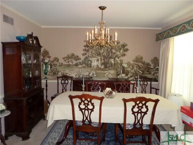 Dining room with Muriel on wall