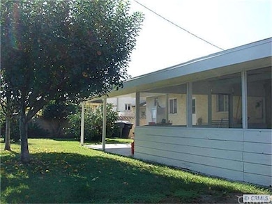 Covered and Screened Patio, Lawn and Fruit Trees