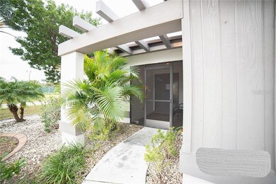 Walkway to Screened/tiled front patio
