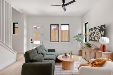 Living room featuring light wood-style flooring a