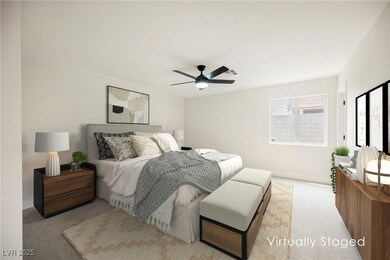 Bedroom with visible vents, a ceiling fan, baseboa