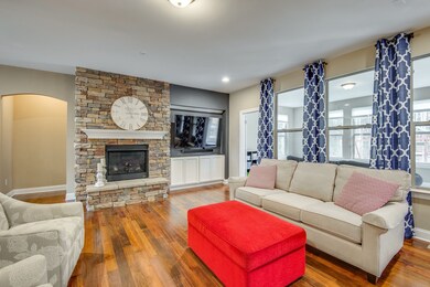 Formal living area with gorgeous stone fireplace - There is also an outlet if you prefer the tv over the fireplace!