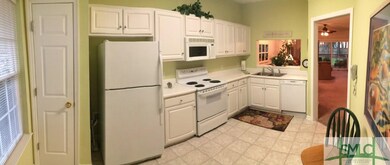 The kitchen has the full complement of appliances,
