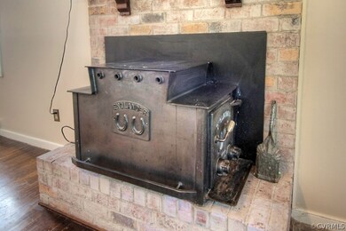 Brick Fireplace with Wood Stove insert.