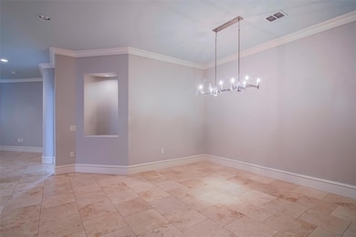 Empty room with crown molding, an inviting chandel