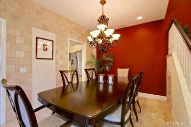 Spacious formal dining room with designer light fi