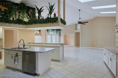 Kitchen featuring stainless steel dishwasher, a si