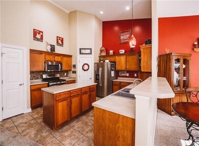 Tons of cabinet storage and a breakfast bar area.