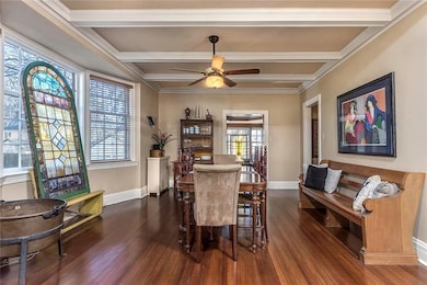 Spacious Dining Room with Beamed Ceiling and Bay W