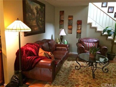 Lovely living area with paver flooring, vaulted ce
